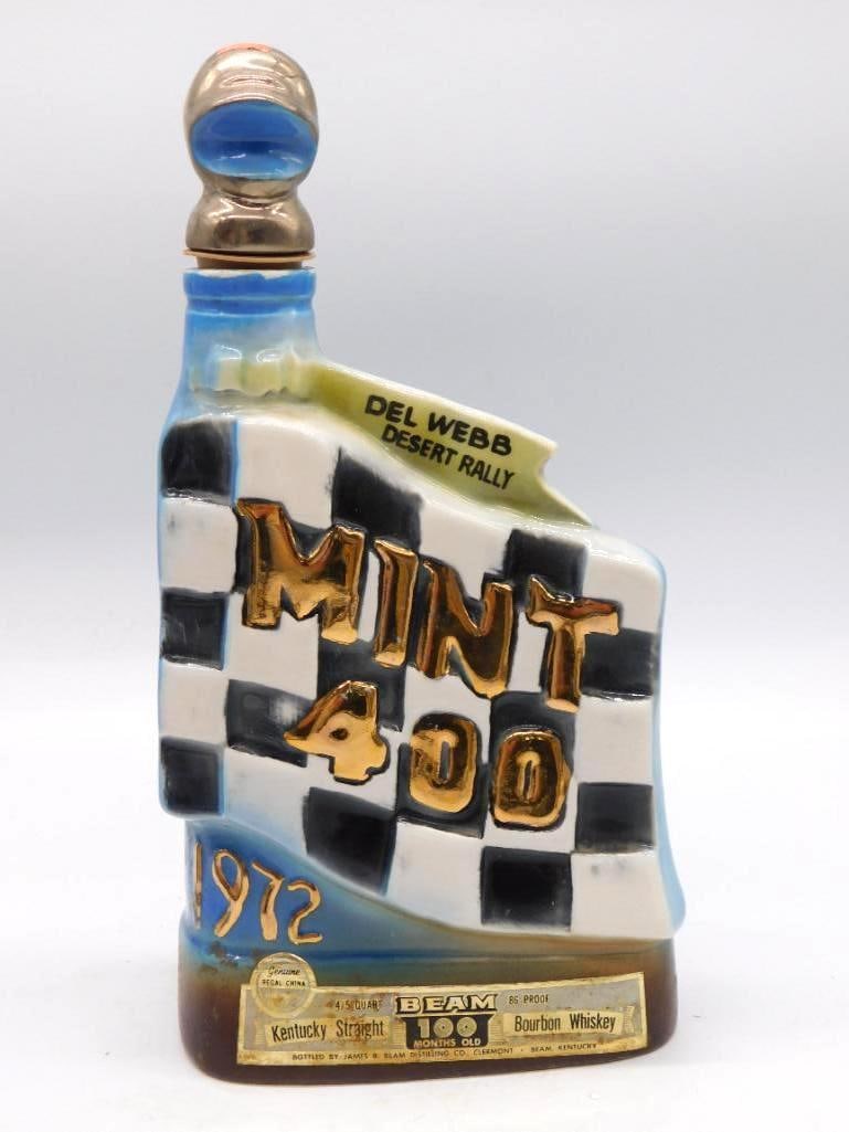 Jim Beam Del Webb Desert Rally 1972: A Jim Beam Regal China mini decanter of 4/5 pint struck for the Del Webb Desert Rally 1972, its black and white checkerboard ground lettered in gold. Marked Kentucky Straight Bourbon Whiskey, 100 Mont