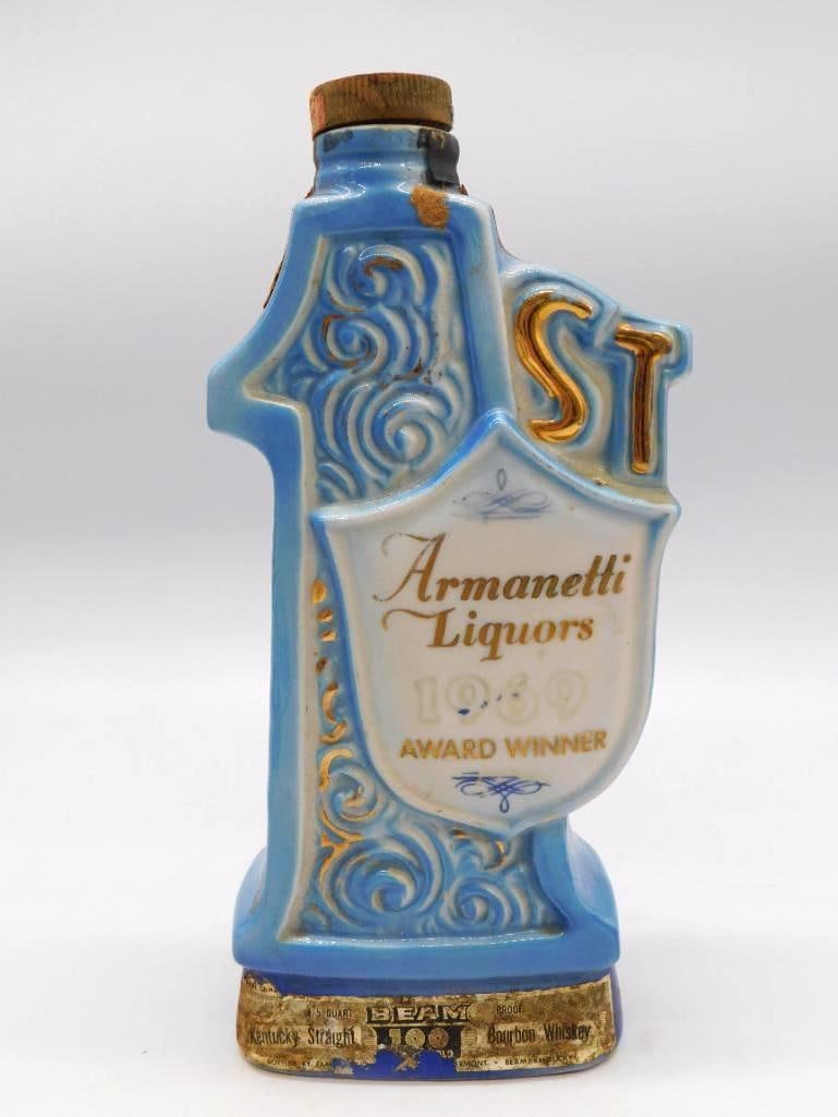 Jim Beam Armanetti Liquors 1969 Award: A Jim Beam Regal China decanter turned in the form of a trophy cup, blue and white with gold scrollwork, commemorating the Armanetti Liquors 1969 Award Winner. Carries the Kentucky Straight Bourbon
