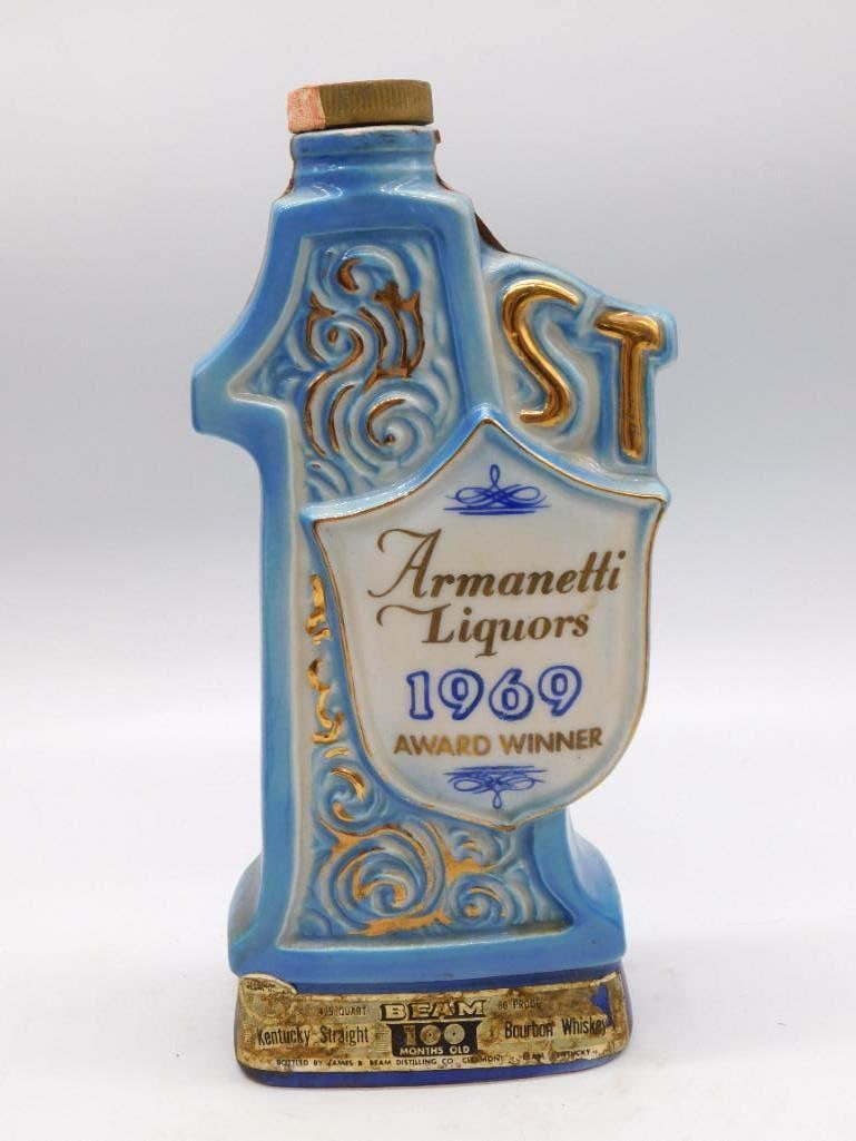 Jim Beam Armanetti Liquors 1969 Award: A Jim Beam Regal China decanter in trophy form, commemorating the Armanetti Liquors 1969 Award Winner, finished in blue and white with gold scrollwork and labeled Kentucky Straight Bourbon Whiskey.