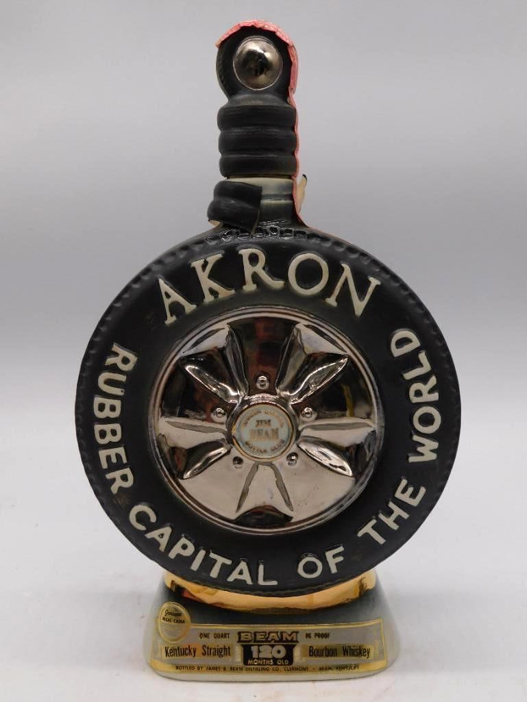 Jim Beam Akron Rubber Capital of the: A Jim Beam ceramic decanter molded as a black-and-white sidewall tire with a chrome-look hubcap at center, lettered Akron, Rubber Capital of the World. Kentucky Straight Bourbon Whiskey, 100 months