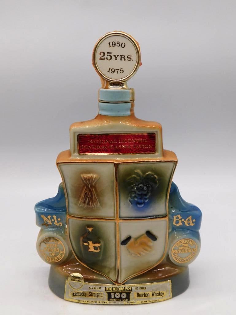 Jim Beam Natl Licensed Beverage: A Jim Beam Regal China decanter issued for the 25th Anniversary of the National Licensed Beverage Association, 1950 to 1975, decorated with a coat-of-arms crest bearing grain, grapes, a jug, and a