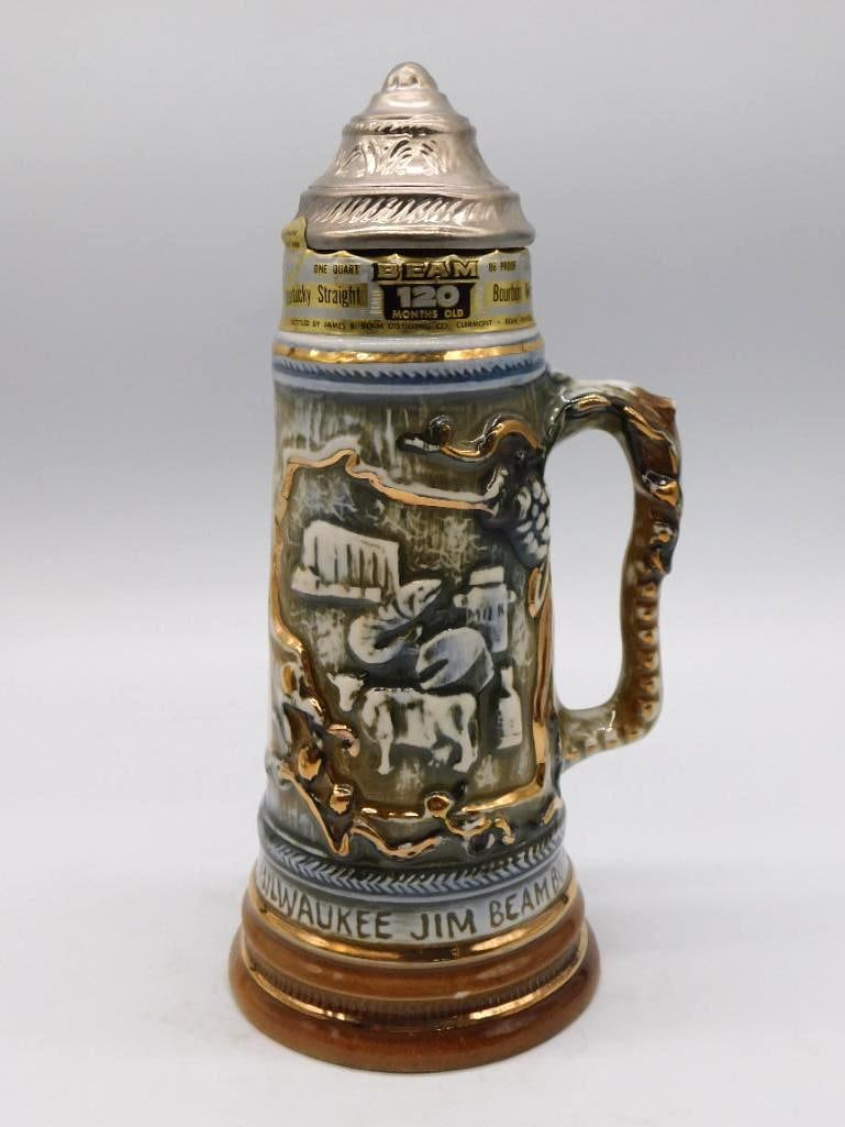 Jim Beam Violet Natl Specialties Clubs: A Jim Beam commemorative ceramic jug decanter titled Violet, made for the National Specialties Clubs, with a floral relief medallion and a silver-tone crown cap. Stands approximately 8.5 inches tall. 