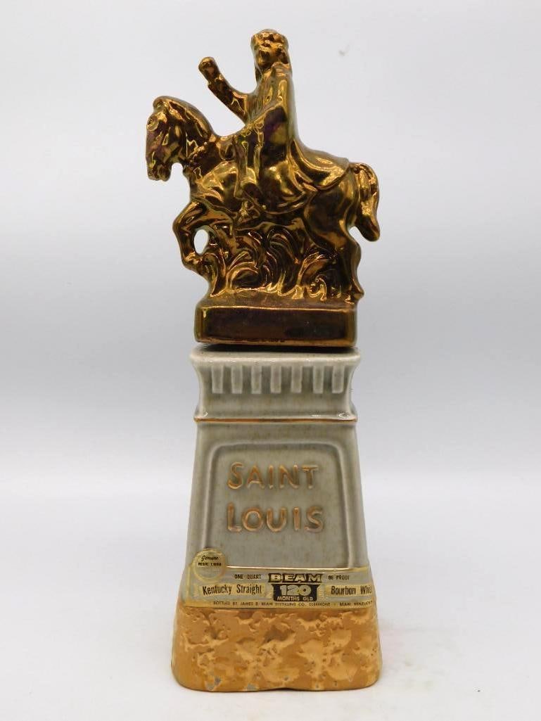Jim Beam Greater Saint Louis Club: A dignified Jim Beam decanter raised for the Greater Saint Louis Area Beam and Specialties Club, a gold equestrian statue mounted upon a grey fluted pedestal above a gilt rocky base set with a silver 