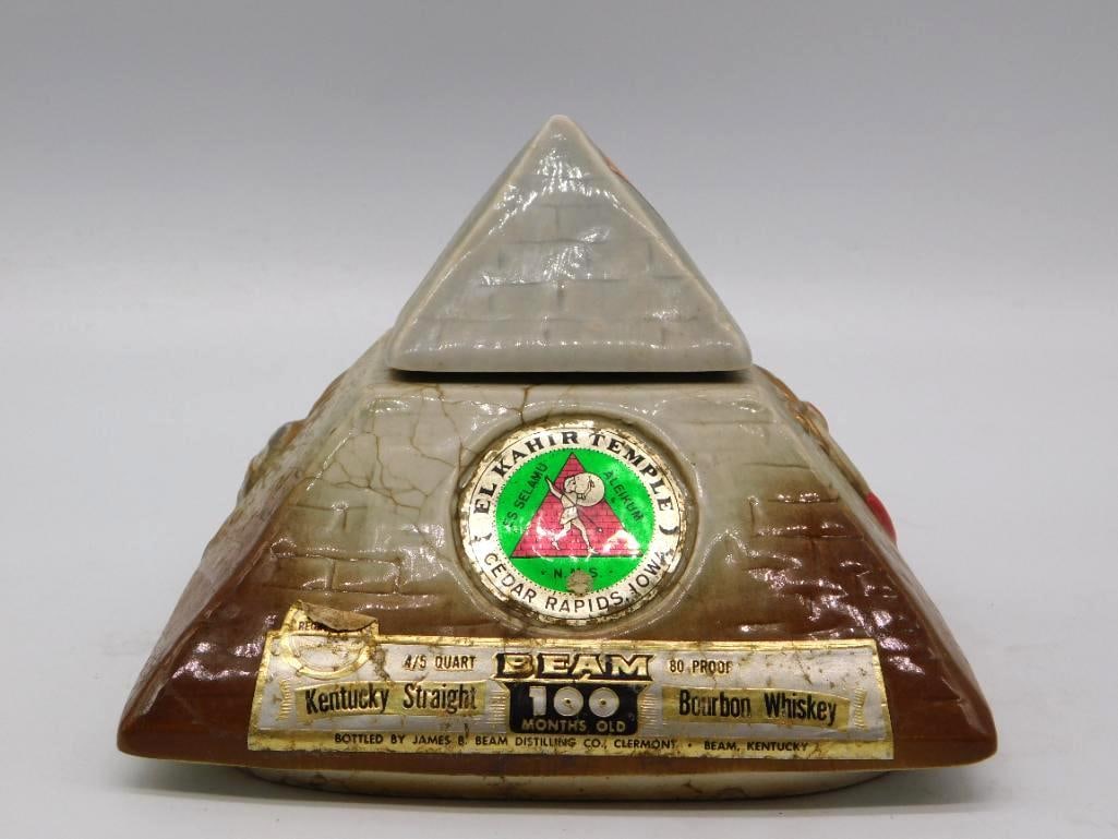 Jim Beam El Kahir Temple Shrine Pyramid: An uncommon Jim Beam Regal China decanter shaped as a pyramid for El Kahir Temple, Oasis of Cedar Rapids, Iowa, the enameled Shrine emblem set at the front and hieroglyphs raised in gold about the