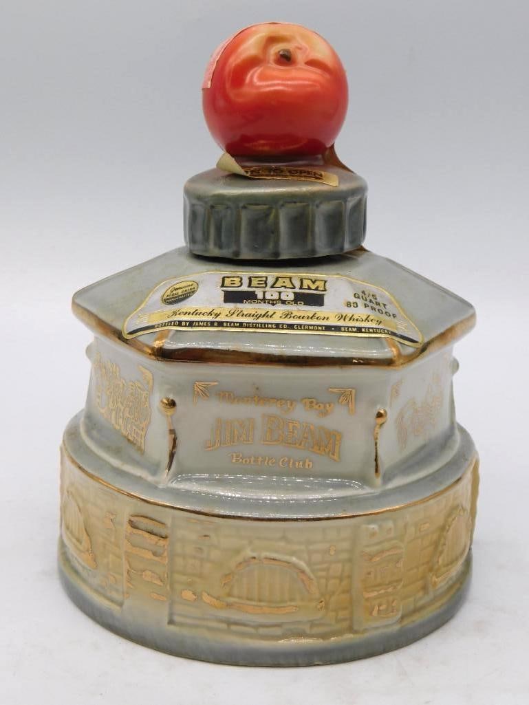 Jim Beam Monterey Bay Bottle Club: A Jim Beam Regal China decanter shaped as the world famous old bandstand at Watsonville, California, its round brick base and hexagonal roof picked out in gold, with a ripe apple serving as the