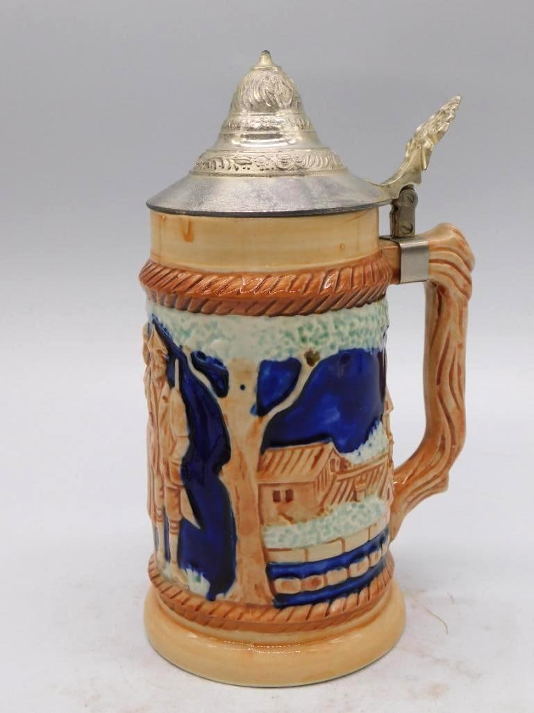 Lionstone Annie Christmas New Orleans: A porcelain decanter by Lionstone Distilleries rendered as "Annie Christmas," the legendary New Orleans dockworker, a whiskey barrel under her arm and an anchor at her side. Her story is printed upon