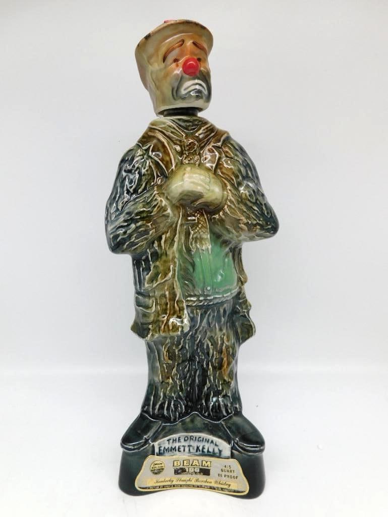 Jim Beam Emmett Kelly The Orig Clown: A Jim Beam Regal China decanter sculpted as the circus clown Emmett Kelly in his tattered hobo costume, the sad expression and red nose caught to the life. Stands approximately 12.5 inches tall, with