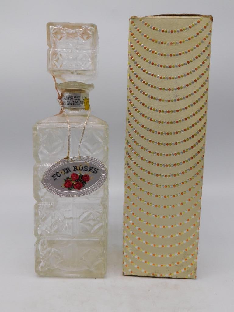 Milk Glass Wicker-Wrapped Decanter, Red: A square milk glass decanter overlaid with a woven wicker-style sleeve and a red floral cameo medallion on the front panel. No maker's mark is visible in the photos provided. See photos for exact