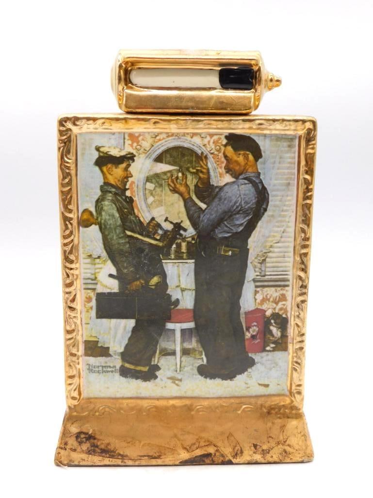 Norman Rockwell The Plumbers Gold-Framed: A ceramic Kentucky Straight Bourbon Whiskey decanter from The Mike Wayne Distilling Co., presenting Norman Rockwell's 'The Plumbers' in the form of a gilt picture frame with the Saturday Evening Post