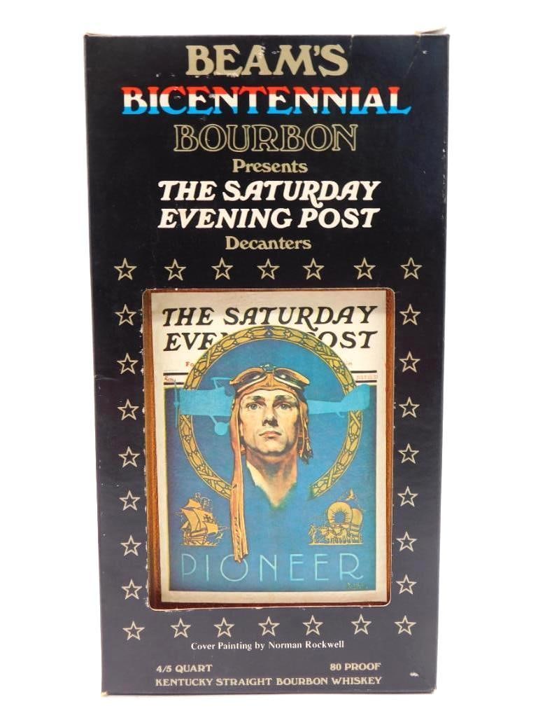 Jim Beam Bicentennial Saturday Evening: A Jim Beam Bicentennial Bourbon decanter from The Saturday Evening Post series, bearing Norman Rockwell's aviation cover art titled Pioneer. The ceramic body wears an embossed leather-look finish