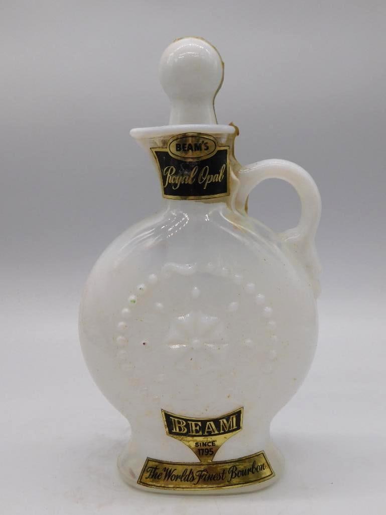 Jim Beam Royal Opal Milk Glass Jug-Form: A milk glass decanter from Jim Beam's Royal Opal series, jug-form with an applied handle and a pressed star-and-dot design that catches the light nicely. The gold labels read Beam Since 1795, The
