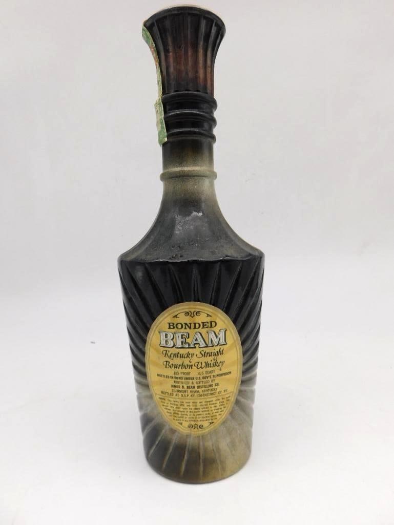 Bonded Beam Regal China Black Sunburst: A Jim Beam decanter of the Bonded Beam issue, glazed in a black and gold sunburst over a ribbed, fan-fold body. Genuine Regal China, the Kentucky Straight Bourbon Whiskey label intact to the front, st