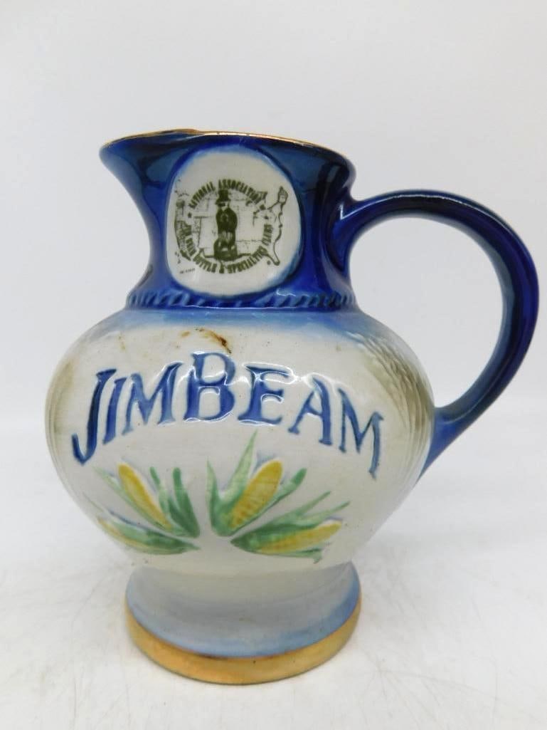 Jim Beam Bottle and Specialties Clubs: A small Jim Beam pitcher glazed deep cobalt at the neck and handle and shading to cream about the body, with ears of corn modeled in relief and hand painted in green and yellow. The front carries the