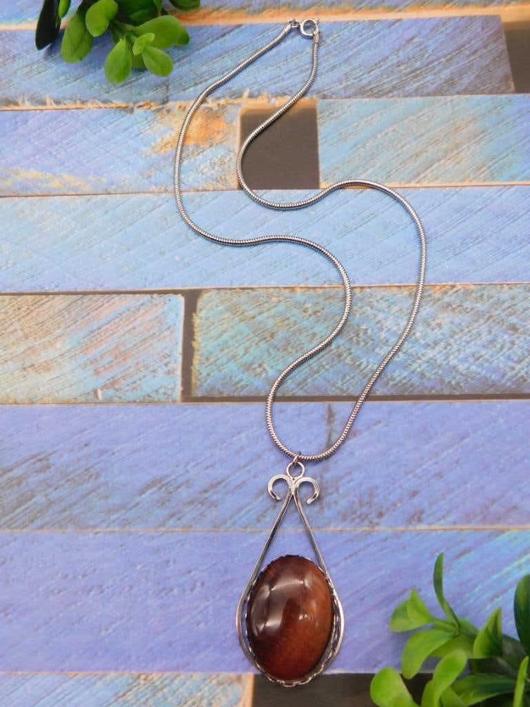 RED TIGER EYE PENDANT ON CHAIN NECKLACE ROCK STONE LAPIDARY SPECIMEN: We are an auction house conducting a live auction with several hundred lots. It sometimes takes up to three weeks to ship, and announcements are made during the auction that affect some items.