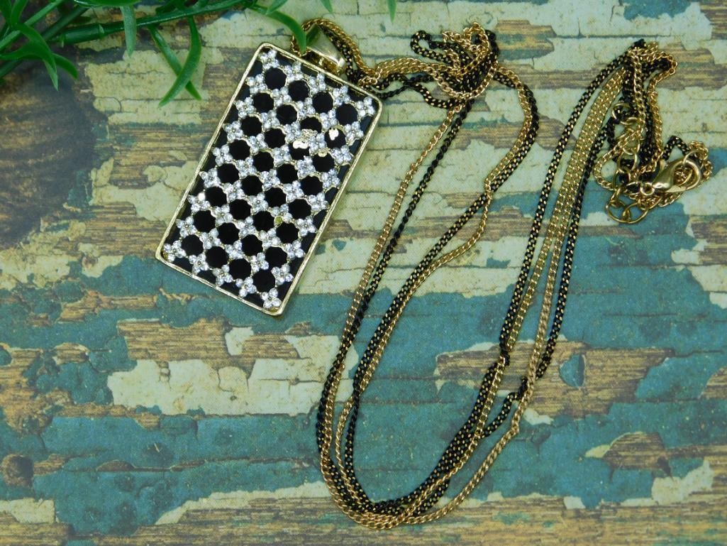 FASHION JEWELRY: We are an auction house conducting a live auction with several hundred lots. It sometimes takes up to three weeks to ship, and announcements are made during the auction that affect some items.