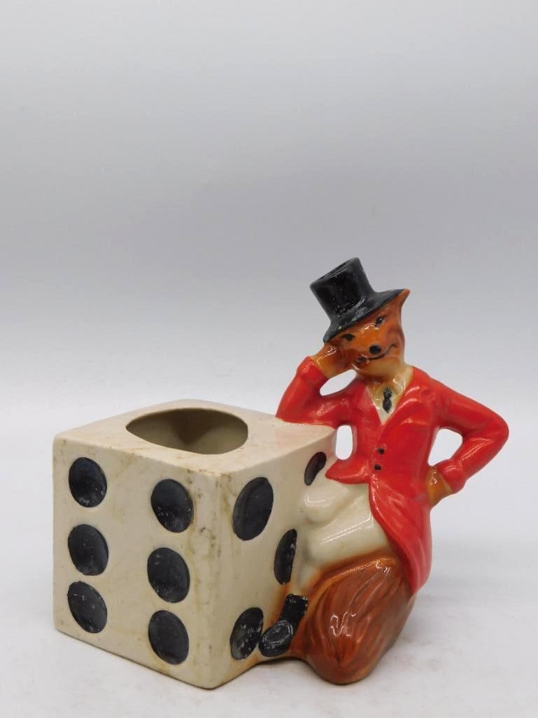 Ceramic Fox Hunter Figurine with Large Dice Toothpick Holder: Genuine Regal China figurine, marked "Creation of James B. Beam Distilling Co., Genuine Regal China 1981," depicting a fox dressed in red hunting jacket and top hat leaning against a large novelty die