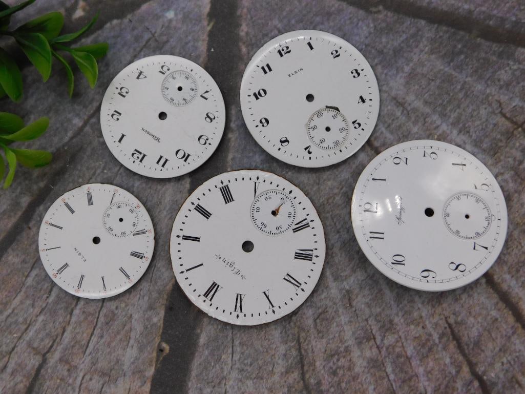 Antique Pocket Watch Dial Lot - Elgin, Waltham, Springfield: Five vintage porcelain enamel pocket watch dials signed Elgin, Waltham, and Springfield, each with a sub-seconds register. Shown with a 1966 quarter for scale, the largest dial measures approximately