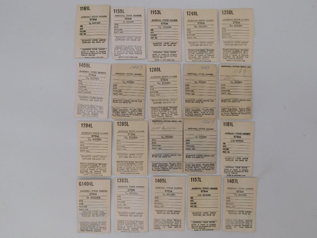 Ephemera: Vintage Marshall Watch Stem Stock Cards Lot: Collection of roughly 20 "Marshall Stock Number" watch stem reference cards, most printed "Made in Switzerland" with handwritten stock notations. One card includes a small sealed bag with a