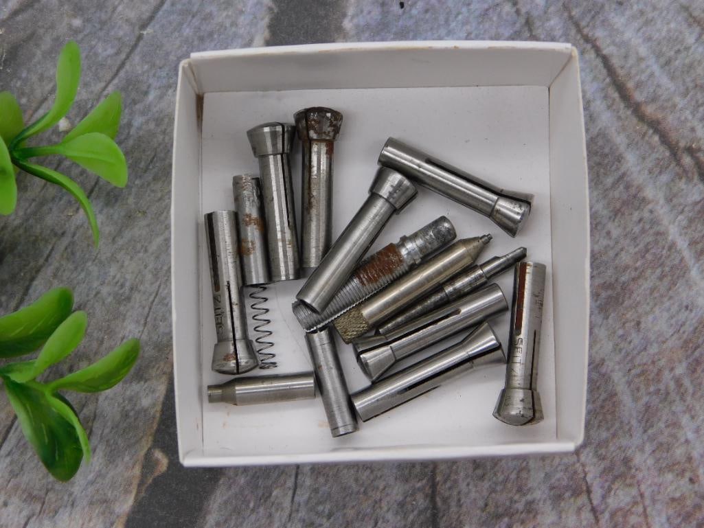 Watch Parts: Lot of Vintage Steel Stems and Staffs: Approximately 15 steel watch stems, staffs, and pivots, some with partial "SETT" style markings, several showing light rust. Shown beside a 1966 quarter for scale, the pieces measure roughly 1 to 2