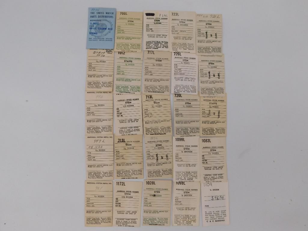 Ephemera: Vintage Marshall Watch Stem Cards and Stems: Approximately 25 "Marshall Stock Number" watch stem reference cards, mostly "Made in Switzerland," together with three loose vintage replacement winding stems shown separately. Includes a Swiss Watch 
