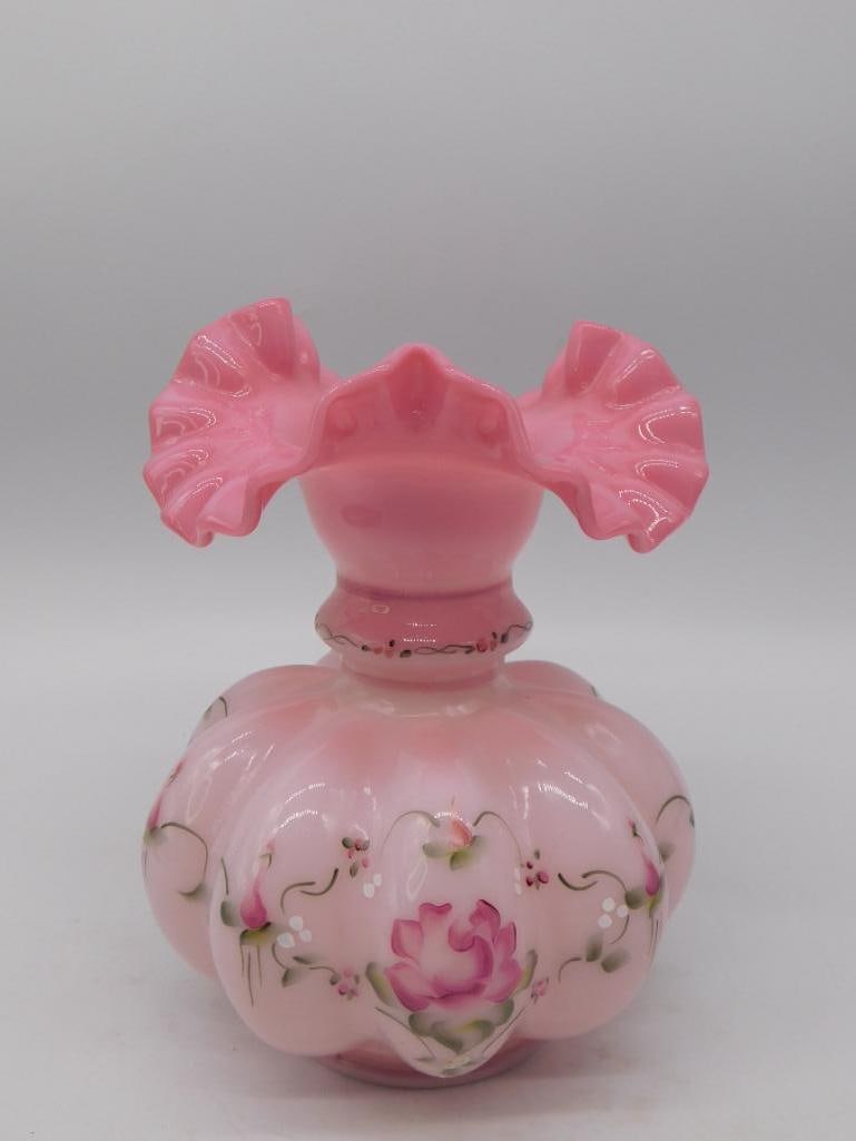 Fenton Pink Satin Hand-Painted Ruffled Art Glass Vase: Melon-ribbed pink satin glass vase with a double-crimped fan top, hand-painted with roses, buds, and green foliage. Marked with the oval 'Fenton, Handpainted in USA' sticker, and the base is signed 'F