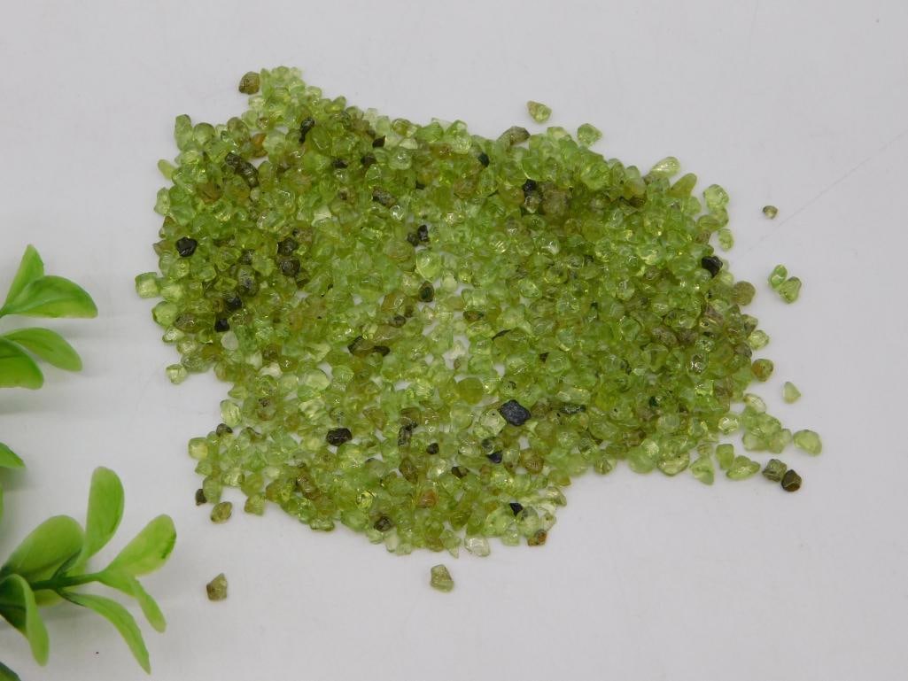 Peridot Rough Gemstone Chips Lot 30 Grams: Lot of natural rough peridot gemstone chips in vivid olive-green tones, weighing 30 grams total. Individual pieces range from small fragments to approximately 1/4 inch, suitable for jewelry making or