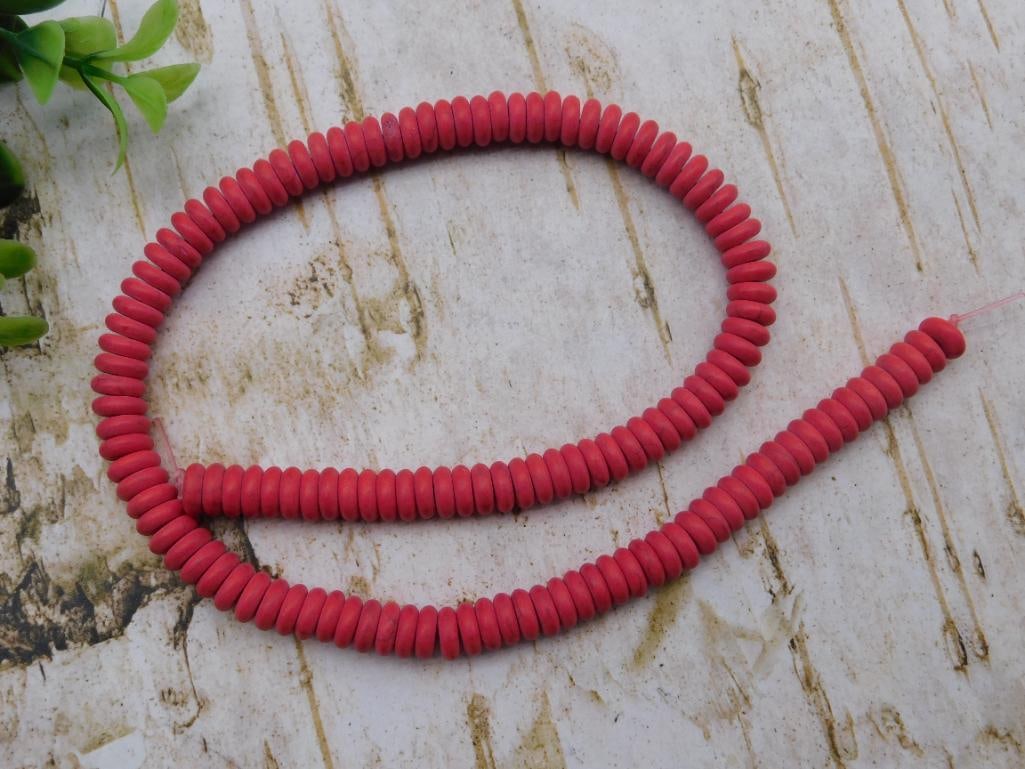 Jewelry Necklace - Red Dyed Stone Rondelle Bead Strand: Loose strand of disc-shaped (rondelle) dyed red stone beads, knotted at both ends with no clasp attached. Beads measure approximately 8-10mm each, with the strand running roughly 24+ inches unclasped.