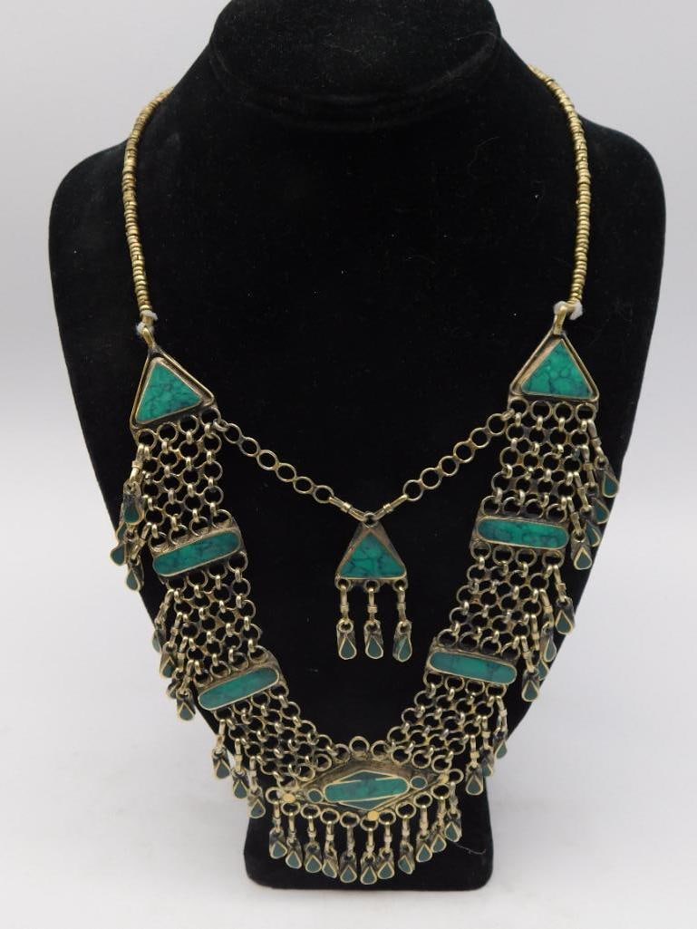 Jewelry Necklace - Tribal Turquoise Inlay with Brass Fringe: Vintage tribal-style bib necklace with triangular and geometric turquoise-color stone inlays set in brass/silver-tone metal, accented with dangling chainmail fringe and teardrop drops. Measures approx