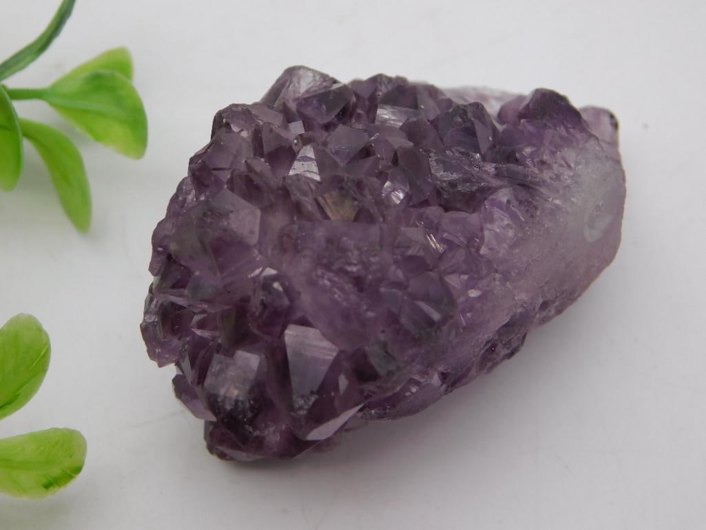 Crystal - Amethyst Geode Cluster Specimen, 73 Grams: Natural amethyst crystal cluster specimen with deep purple pointed crystal formations on one face. Weighs 73 grams and measures roughly 2.5 inches, notably larger than the quarter pictured. Good natur