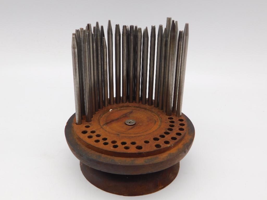 Tool: Antique Wooden WATCHMAKER PUNCH HOLDER: Wooden pincushion-style tool holder fitted with a full set of roughly two dozen steel awls and punches with varied tip profiles. A ruler photo shows the piece measures approximately 4.5 inches tall. T