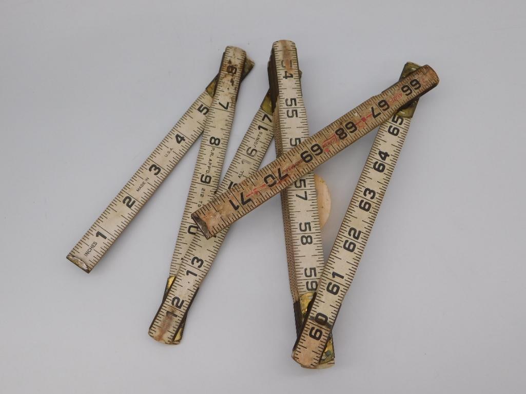 Vintage Lufkin Folding Wood Carpenter's Rulers, Set of Two: Two vintage wooden folding extension rulers by Lufkin, model 460F Universal, marked with patent date. Rulers extend to reveal inch markings 1 through 71+; shown measured against a steel ruler for