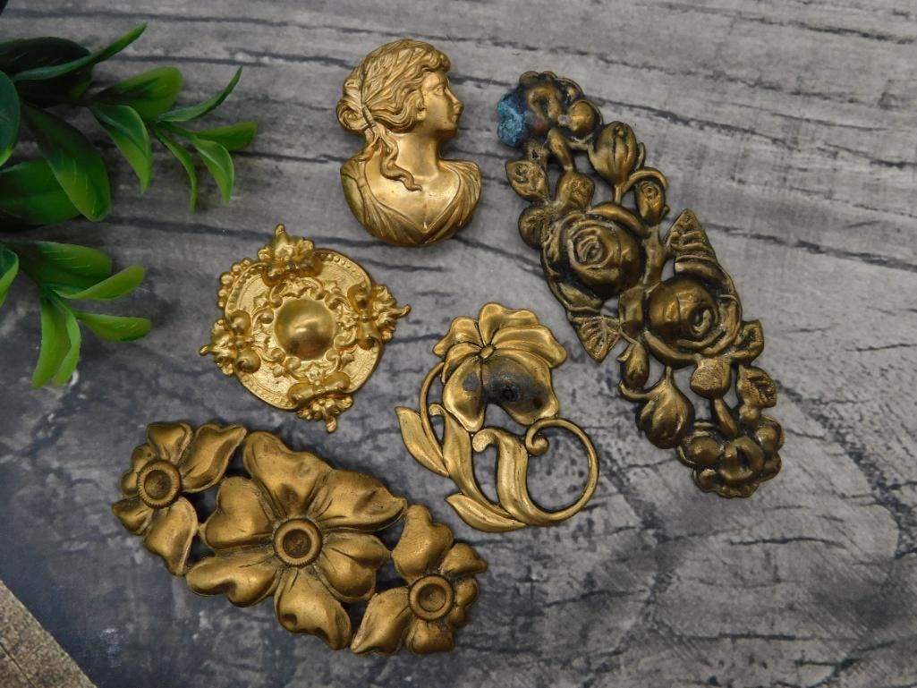 Antique Brass Furniture Mounts - Victorian Cameo, Floral and Rose Appliques: Group of six ornate cast brass/gilt-metal furniture or decorative appliques including a classical female cameo bust, a floral rosette medallion, rose garland scrollwork, a tri-flower mount, and a