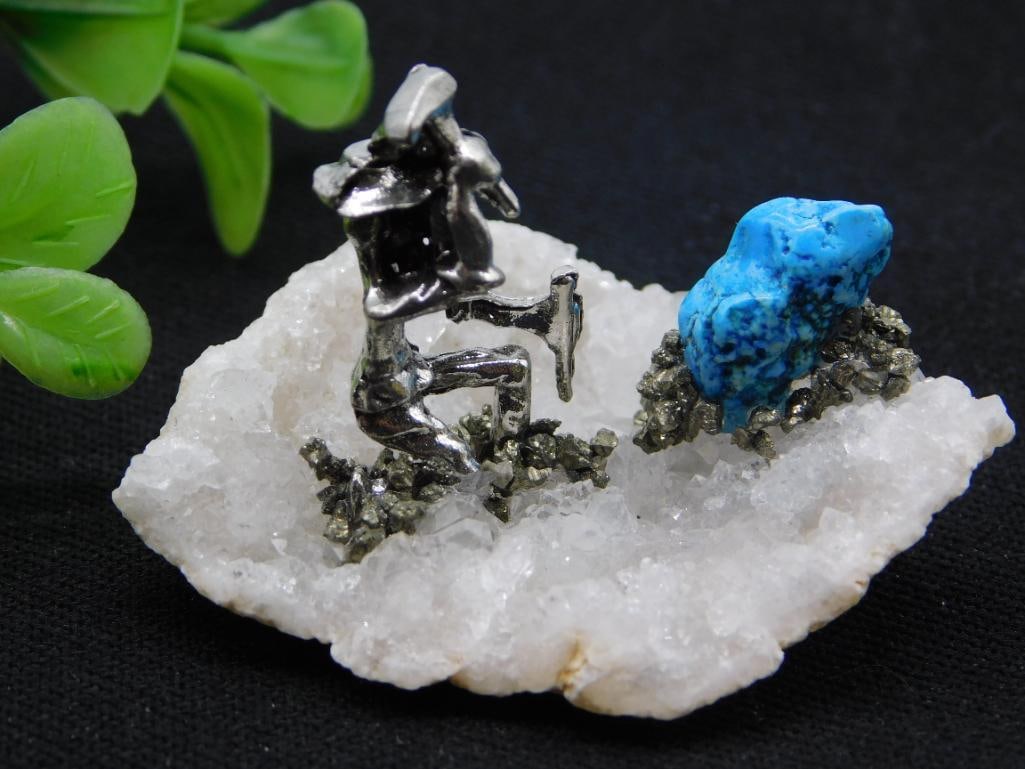Mineral Quartz Pyrite Cluster with Silver Miner Figurine: Decorative natural quartz and pyrite (fool's gold) cluster matrix accented with a small silver-tone miner figurine and a rough turquoise nugget, forming a novelty mineral display piece. The lot tag li