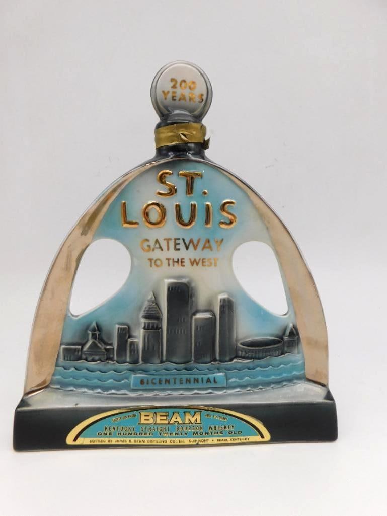 Jim Beam St. Louis Gateway Arch: A Jim Beam Regal China decanter shaped as the Gateway Arch at St. Louis, marked 200 Years and Bicentennial. Labeled 120 months old Kentucky Straight Bourbon, with the tax stamp intact. A stately