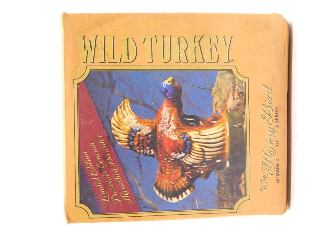 Wild Turkey Flying Bird No. 3 Miniature: A trim Wild Turkey miniature in porcelain, "The Flying Bird," number 3 of the limited edition series. Approximately 6 to 7 inches wide and complete with its original branded box. The box shows age