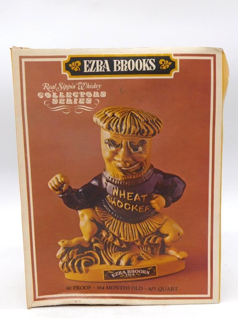 Ezra Brooks Wichita State Wheat Shocker Mascot Decanter with Original Box: An Ezra Brooks ceramic decanter modeled as the Wichita State Wheat Shocker mascot in black gold and yellow from the Real Sippin' Whiskey Collectors Series. Marked 90 Proof and 164 Months Old. Comes wi