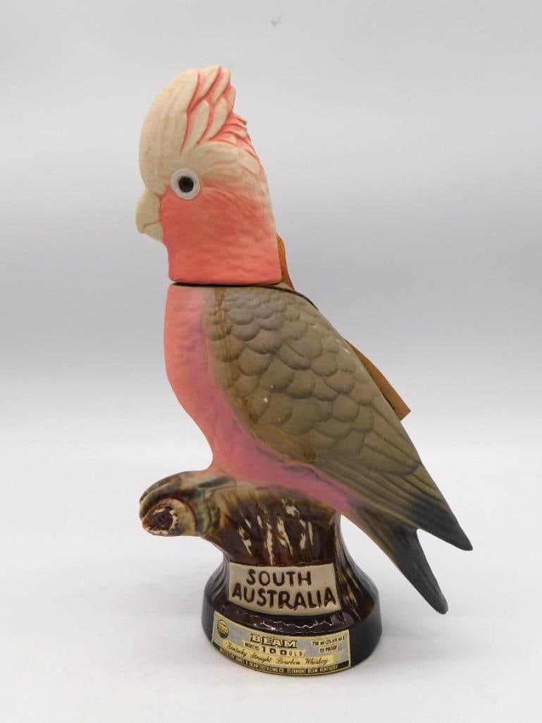 Jim Beam South Australia Galah Cockatoo Decanter with Swing Tag: A Jim Beam Regal China decanter modeled as an Australian Galah that pink and grey cockatoo marked South Australia to the base. Carries the Kentucky Straight Bourbon Whiskey label and its original swin