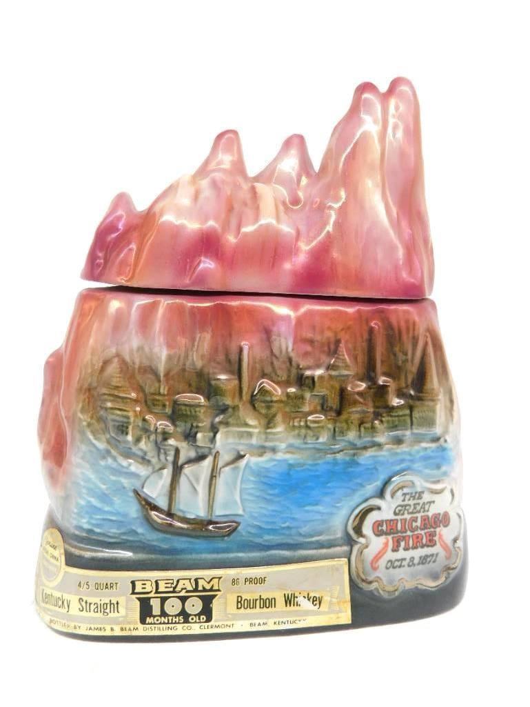 Jim Beam Great Chicago Fire 1871 Regal China Decanter Mercy Hospital: A striking Jim Beam Regal China decanter recalling the Great Chicago Fire of October 8 1871 the skyline and lake front modeled in relief beneath a stopper cast as rolling flame. The reverse panel