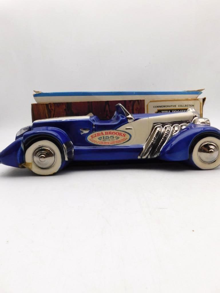 Ezra Brooks Classic Roadster Decanter in Blue and White with Original Box: An Ezra Brooks decanter from the Commemorative Collection cast as a long-hooded classic roadster in cobalt and cream with chromed exhaust pipes and whitewall tires. A piece with genuine presence on a 