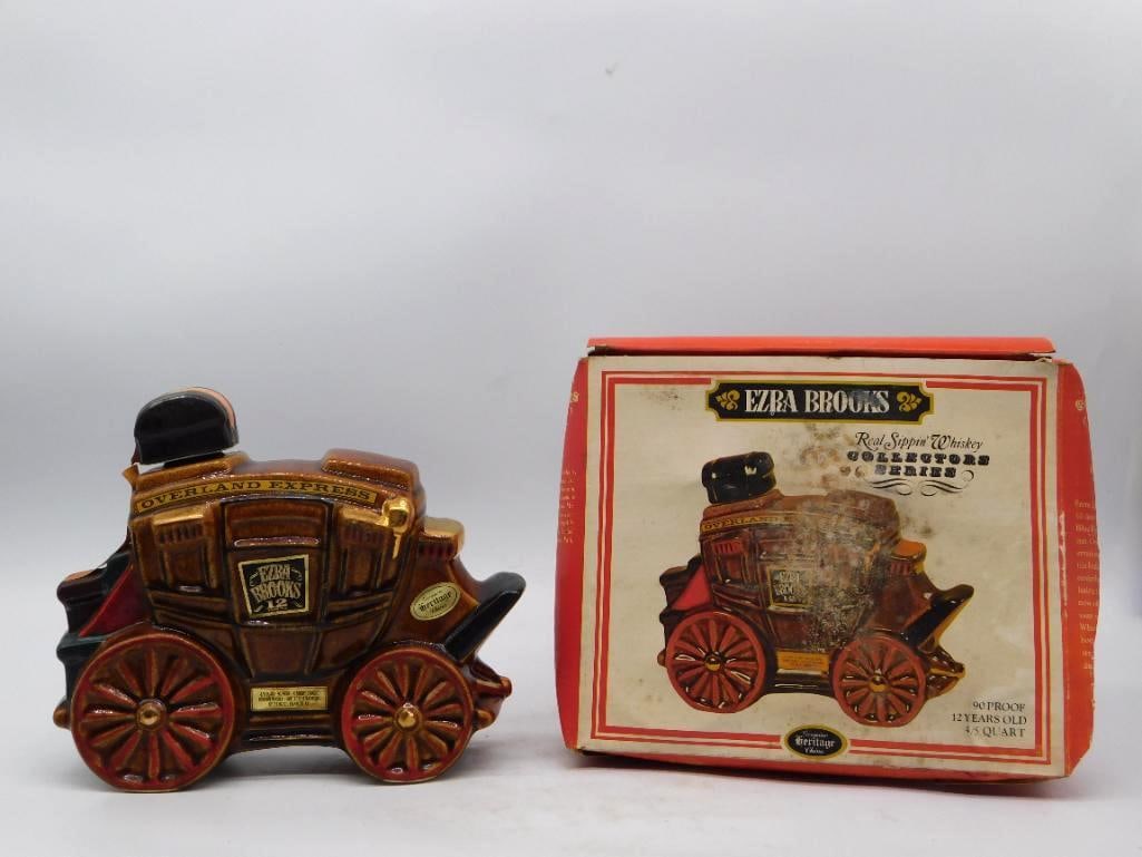 Ezra Brooks Overland Express Stagecoach Decanter with Original Box: A spirited Ezra Brooks Overland Express stagecoach in Heritage China the coach body lettered across the roofline and set upon stout red spoked wheels. The brown glaze is rich and the gilt lamps and do