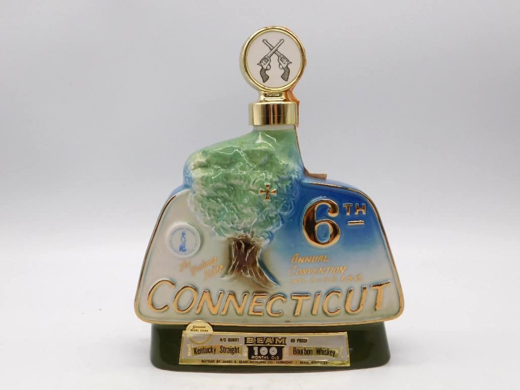Jim Beam 6th Annual Convention Hartford Connecticut 1976 Club Decanter: A Jim Beam decanter struck for the 6th Annual Convention of the International Association of Jim Beam Bottle and Specialties Clubs held at Hartford Connecticut in 1976. The face carries the charter oa