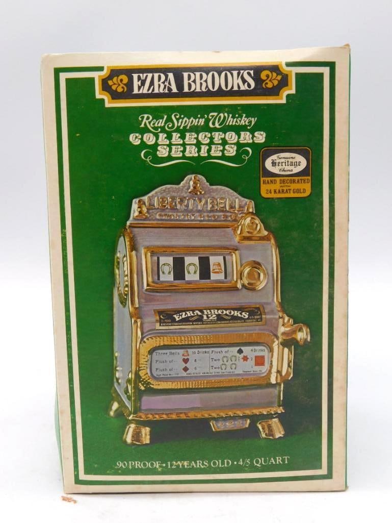 Ezra Brooks Liberty Bell Slot Machine Decanter with Original Box: An Ezra Brooks Collectors Series decanter cast as the Charles Fey Liberty Bell slot machine Heritage China with hand decoration in 24-karat gold. Rises roughly 9 inches and comes housed in its origina