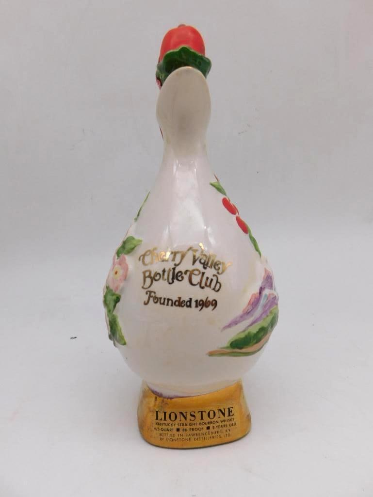 Lionstone Cherry Valley Bottle Club Ewer Decanter with Cherries: A Lionstone porcelain ewer-form decanter made for the Cherry Valley Bottle Club hand-painted with cherries and a mountain landscape the handle and base finished in gold. Handsome enough to earn a plac