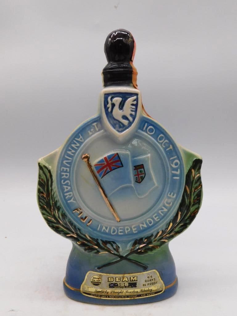 Jim Beam Fiji Independence 1971 Commemorative Decanter Seal Intact: A Jim Beam ceramic decanter marking Fiji's independence one face reading 1st Anniversary Fiji Independence 10 Oct 1971 and the reverse Cession 1874 / Independence 1970 The Hub of the Pacific with dove