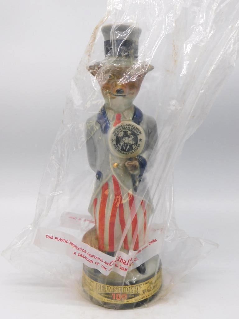 Jim Beam Uncle Sam Fox Beam Bottle Club Whiskey Decanter Seal Intact: A Jim Beam Regal China decanter modeled as a fox turned out in Uncle Sam's frock coat striped trousers and stovepipe hat a cane tucked under one arm. He wears the National Association of Jim Beam Bott