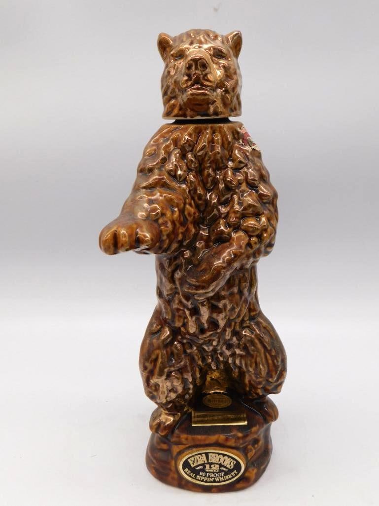 Ezra Brooks Real Sippin' Whiskey Standing Bear Decanter Seal Intact: A stout Ezra Brooks decanter modeled as a standing brown bear from the Real Sippin' Whiskey line 90 proof and 12 years old. Ceramic approximately 12 inches tall the bottle still full and sealed with