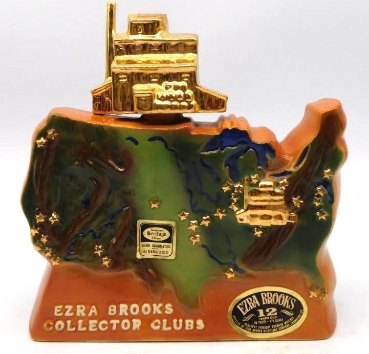 Ezra Brooks Collector Clubs United States Map Decanter in 24K Gold Seal Intact: An Ezra Brooks decanter cast in the shape of the United States the map worked in green and rust with gold stars marking the collector clubs and their names lettered across the reverse. A gold