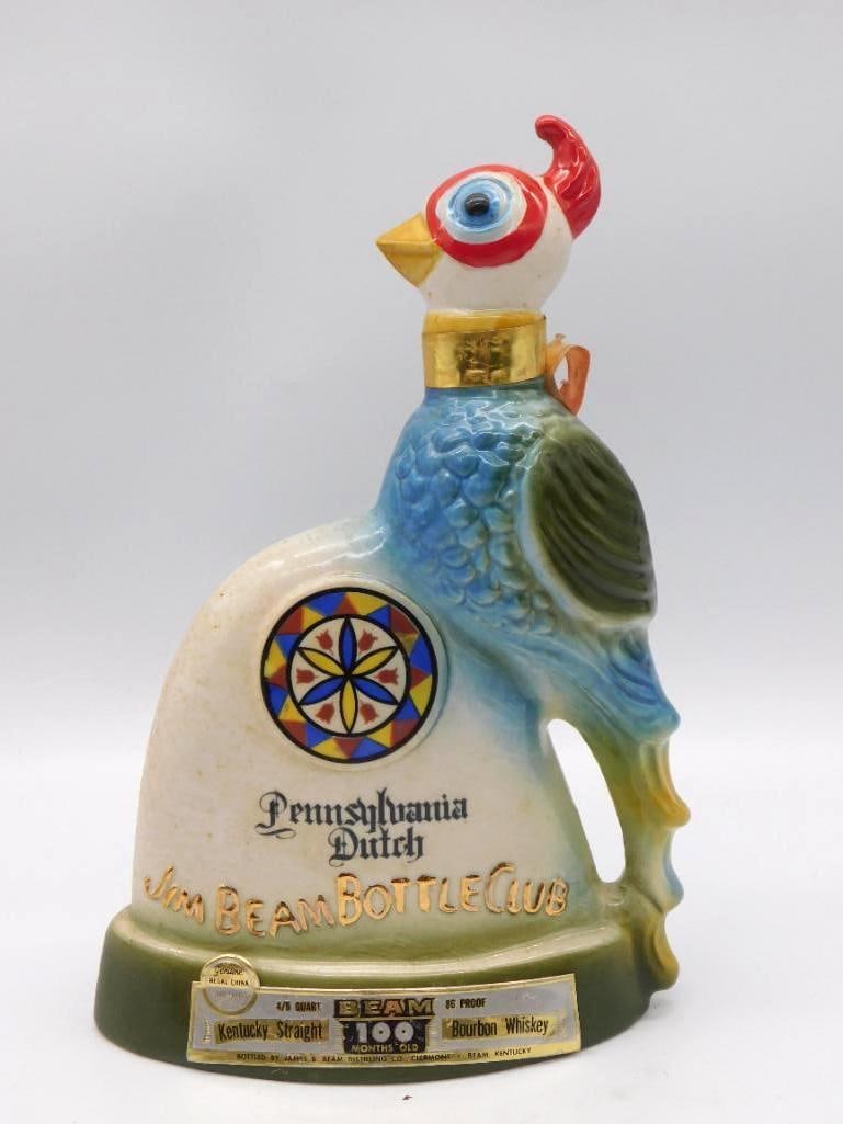 Jim Beam Pennsylvania Dutch Bottle Club Rooster Decanter: A lively Regal China decanter modeled as a rooster in full color its body bearing a hex-sign design and the Pennsylvania Dutch Jim Beam Bottle Club marking. Approximately 11 inches tall in the 4/5