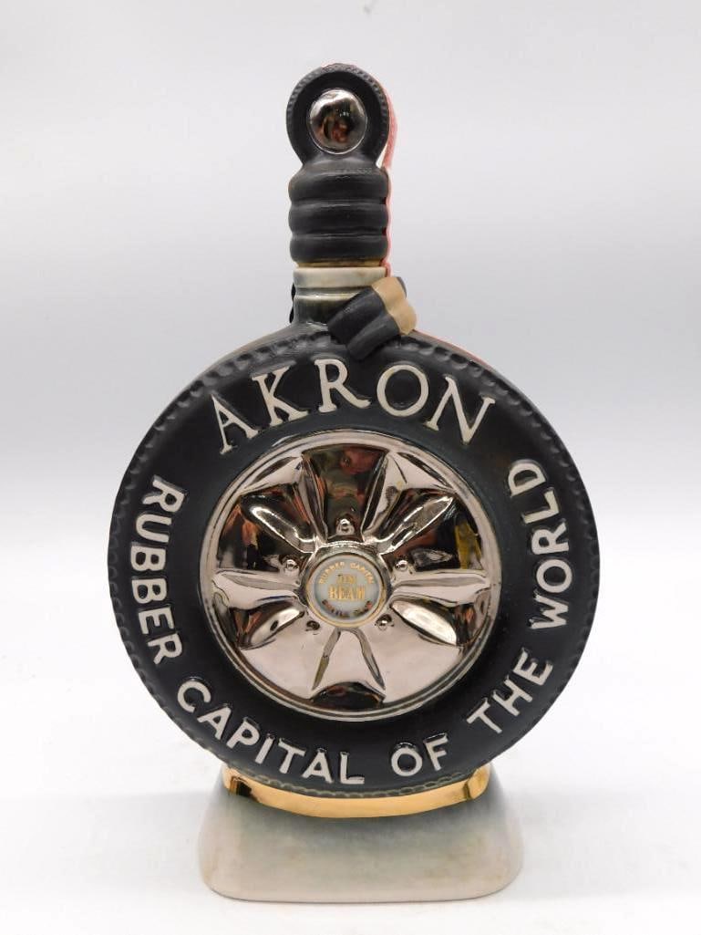 Jim Beam Milwaukee Beer Stein Ceramic Decanter: A Jim Beam decanter formed as a beer stein with a molded handle its body worked in relief with a tavern scene and lettered Milwaukee Jim Beam. Marked 120 months old Kentucky Straight Bourbon. Approxim