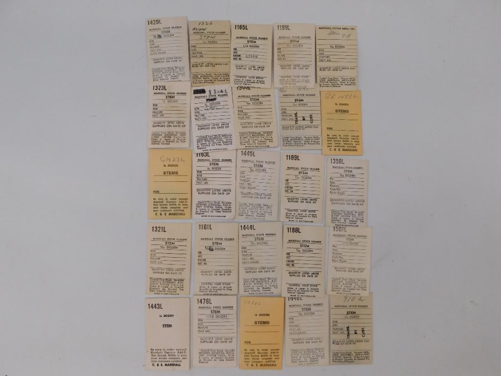 Mixed Lot of Pocket Watch Dials and Stem Reference Cards: Mixed watch parts lot combining five porcelain pocket watch dials marked Standard and Elgin with a group of roughly 20 Marshall watch stem stock cards and one AS caliber 1560 winding stem reference ca